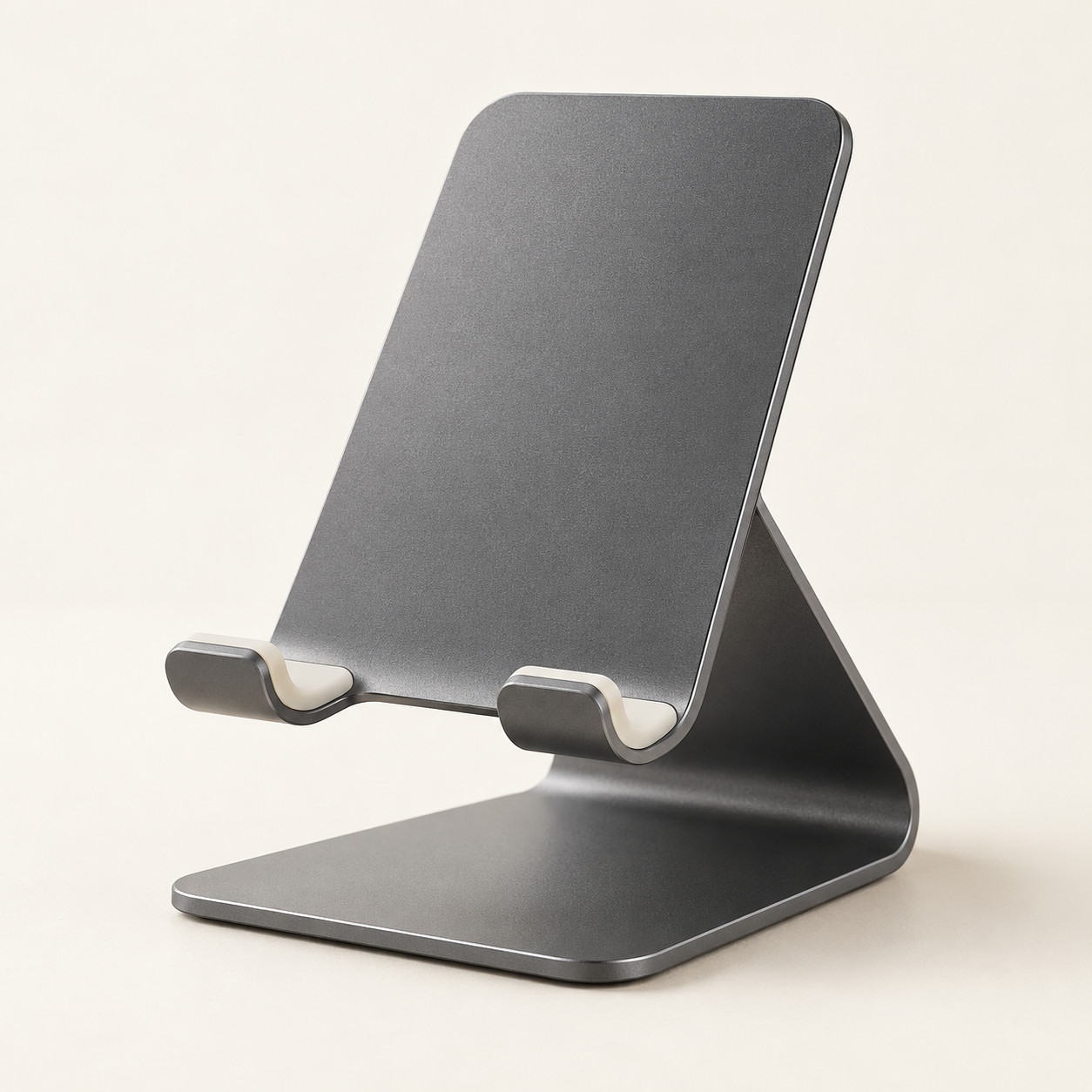AI-generated concept image: aluminium phone stand on a warm ivory studio background.